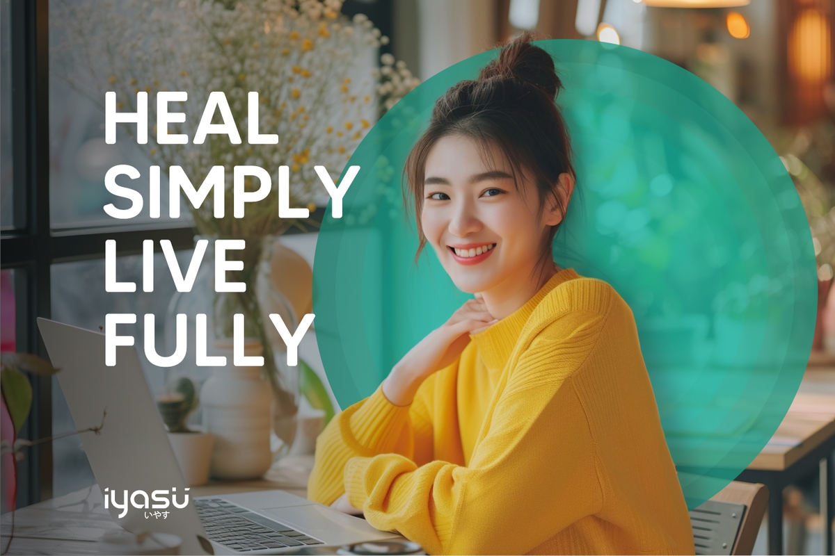 Smiling woman in a yellow sweater by a laptop with the text 'HEAL SIMPLY, LIVE FULLY' and the Iyasu logo.